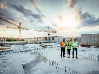 Group of construction workers on a roof top 