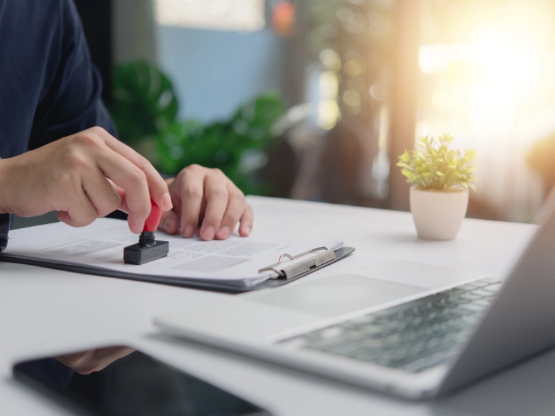 individual business person stamps document approval