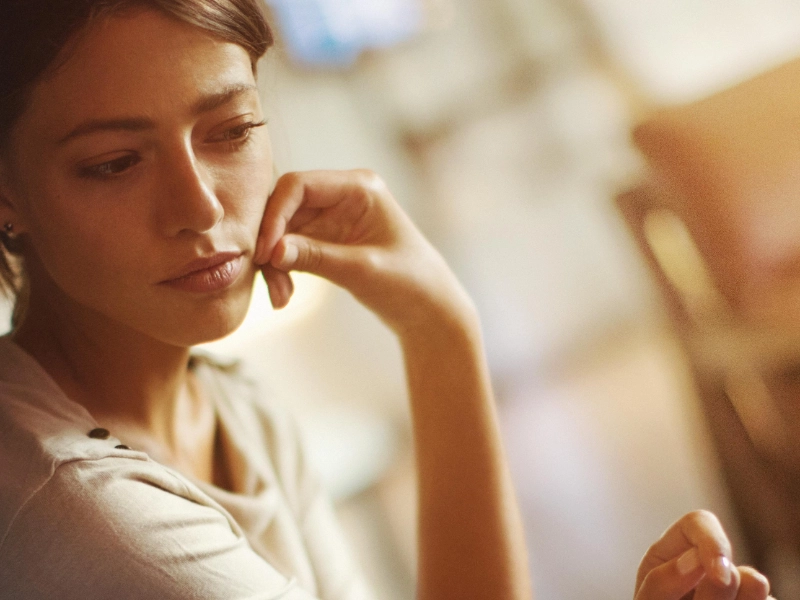 woman and man looking at laptop
