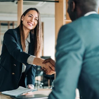 woman shakes hand of man