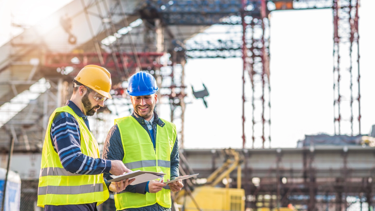 two construction workers conducting a survey image