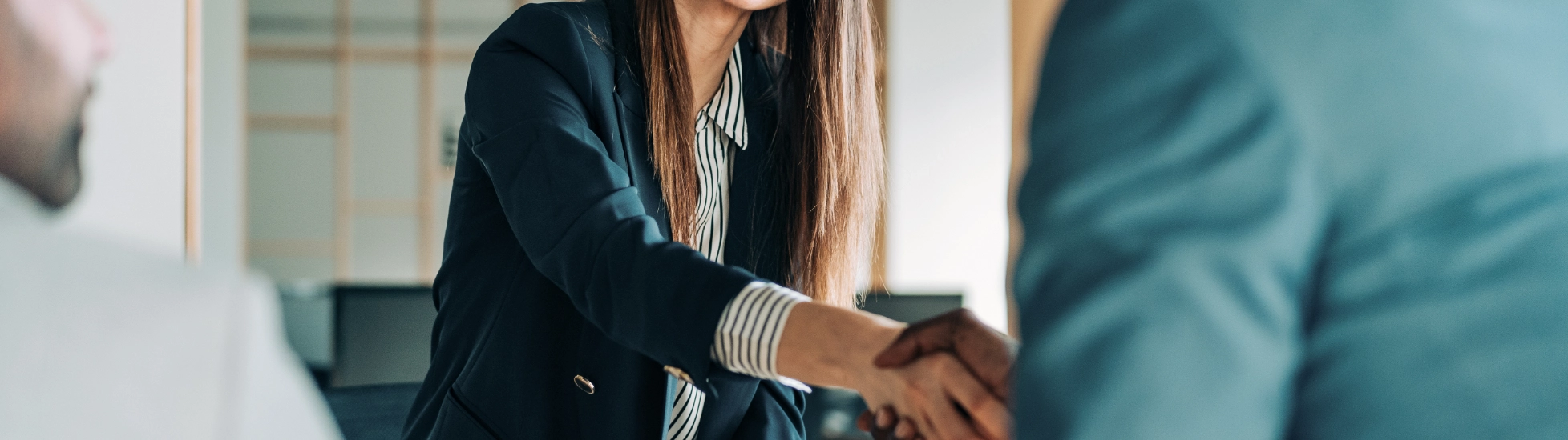 woman shakes hand of man