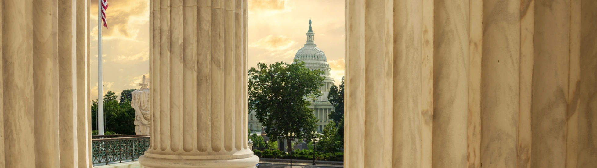 capitol building through columns of supreme court