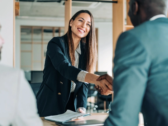 woman shakes hand of man