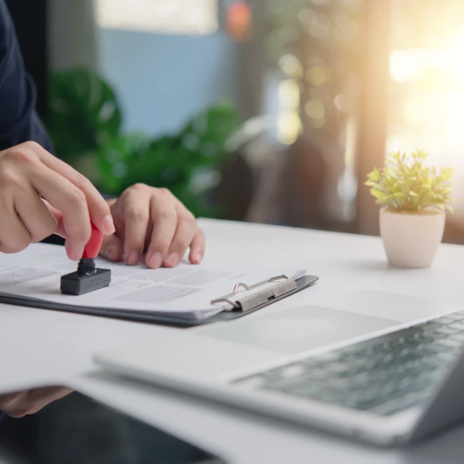 individual business person stamps document approval