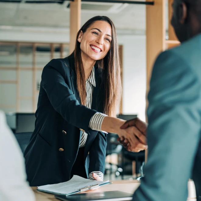 woman shakes hand of man