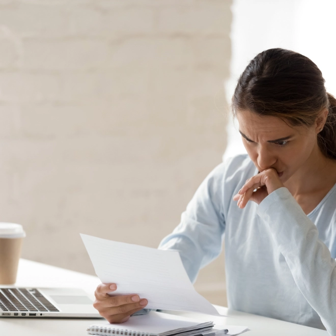 Woman looking at letter
