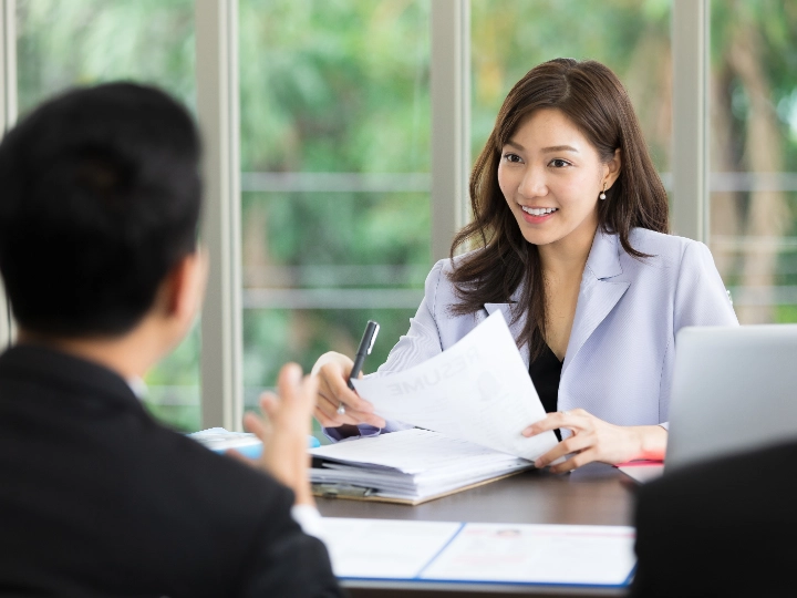 Asian Woman Hr Officer Holding Resume